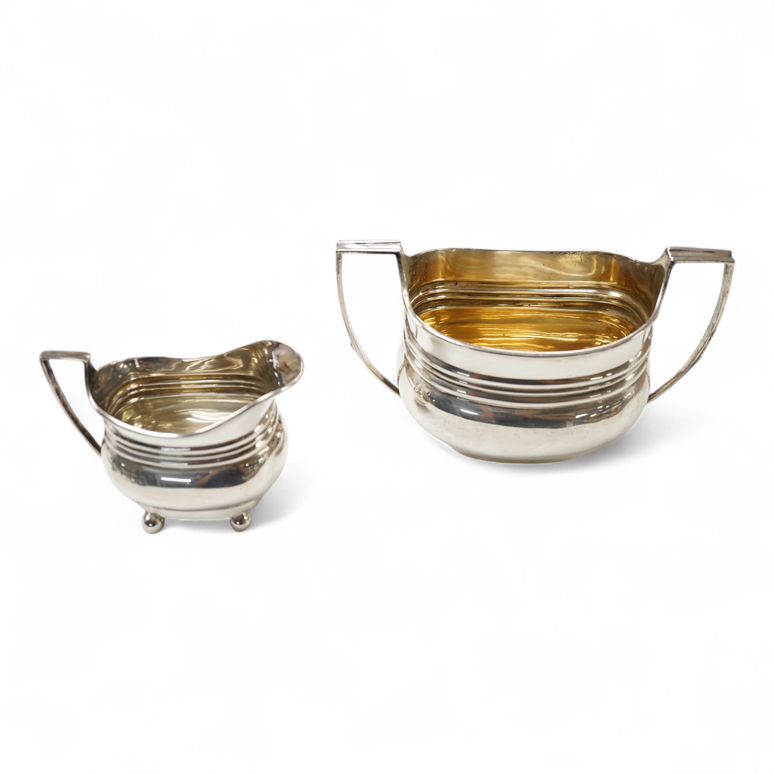 A late 19th/early 20th century matched silver three piece tea set, by W & G Sissons, London, 1898 and The Barnards, London, 1903, gross weight 33oz.